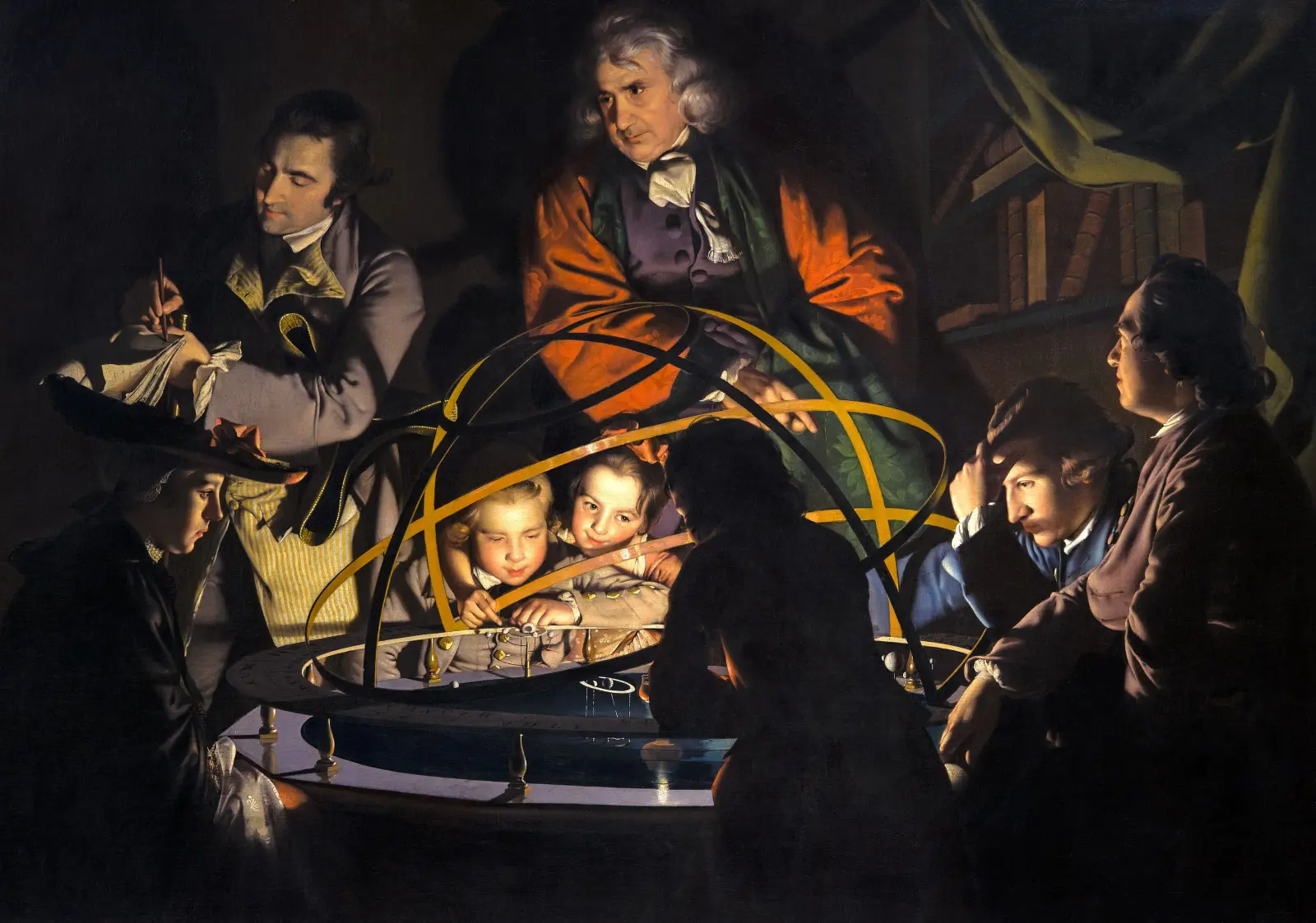 Des enfants et des adultes, éclairés par une lampe, se penchent sur une maquette du système solaire.